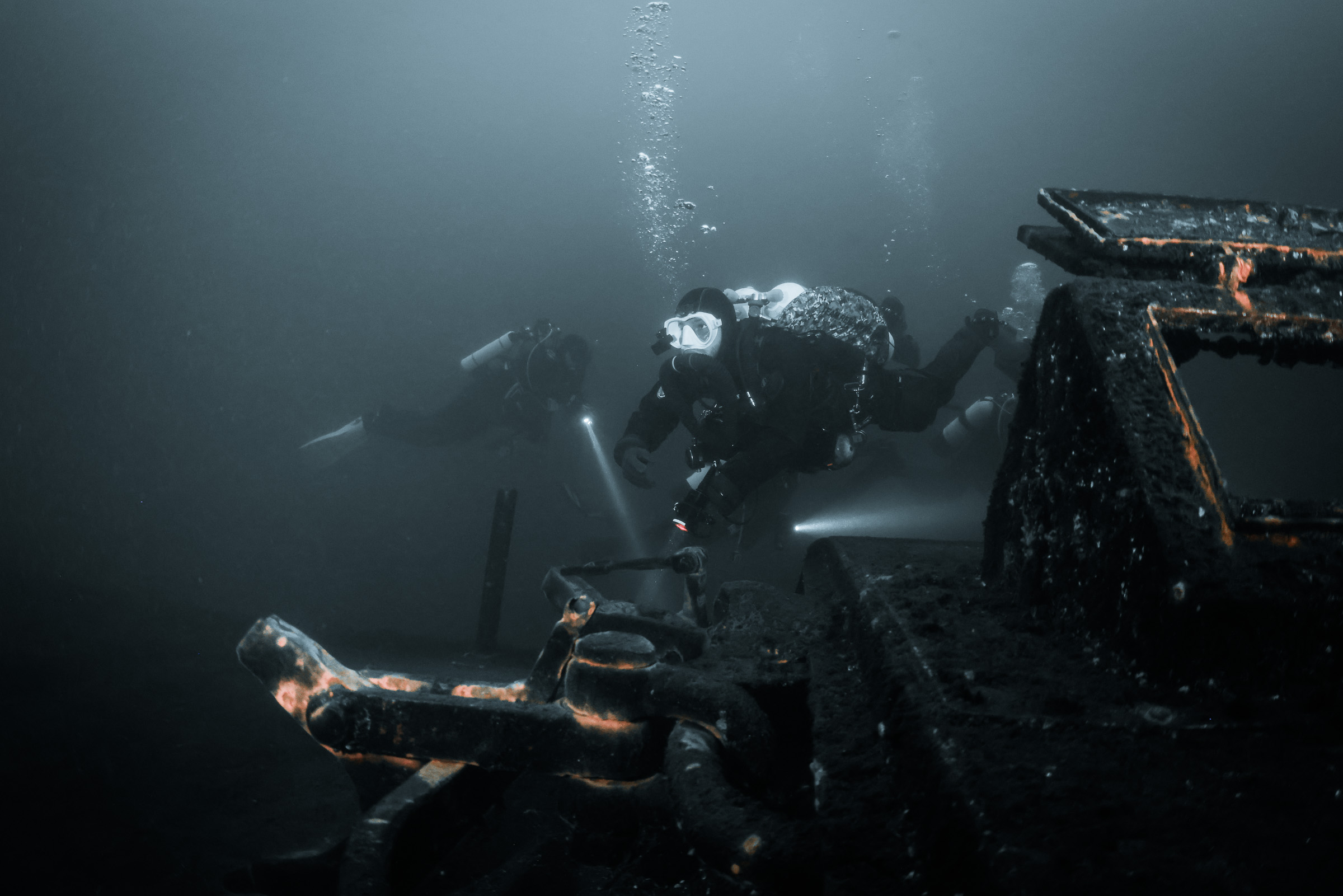 Diver swimming over a wreck, Stoney Cove, 20 m