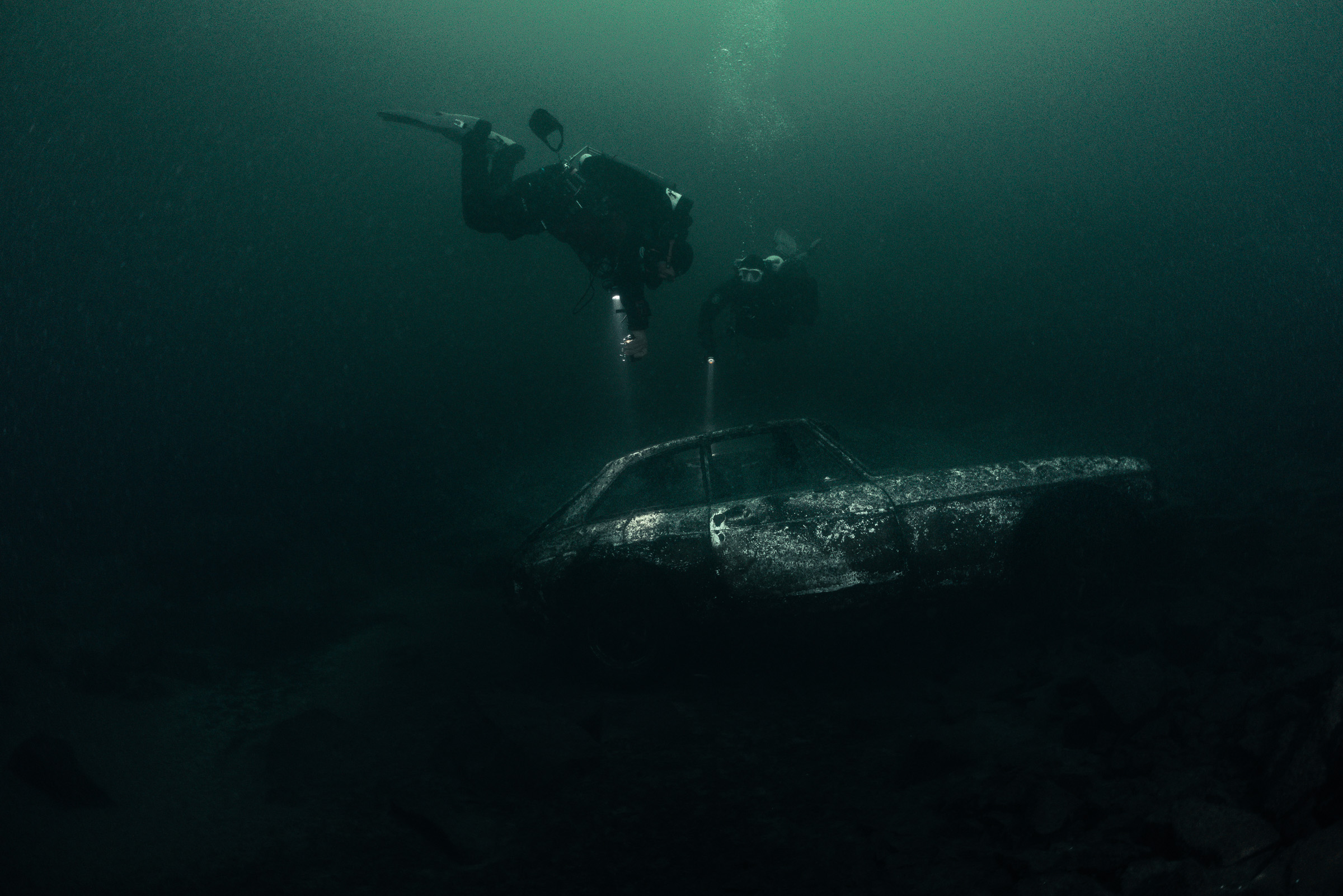 Sunken car wreck seen in the distance, Stoney Cove, 20 m